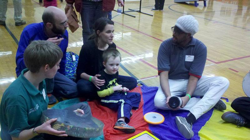 Music therapy students sitting on floor