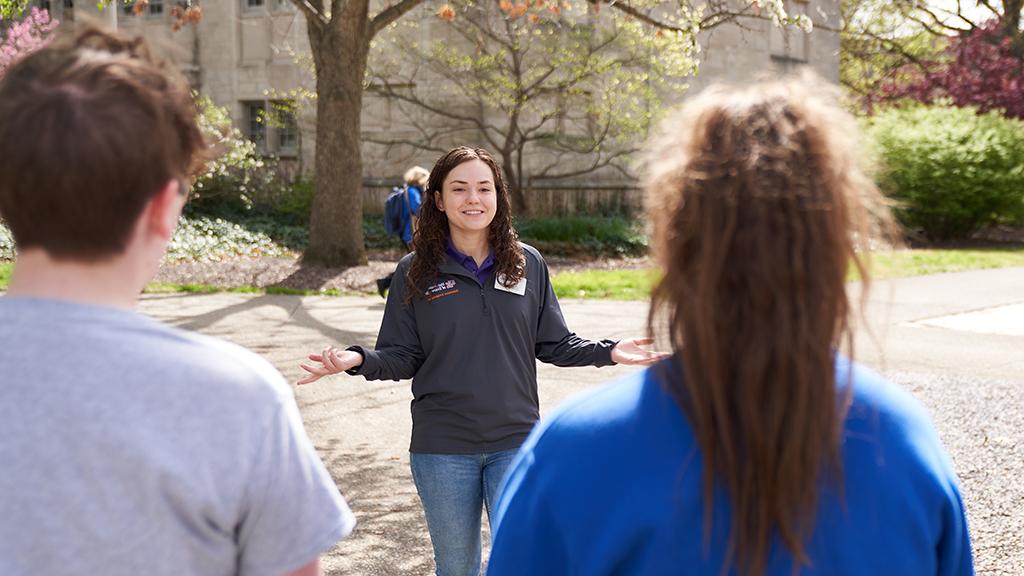 Student leads a tour outside